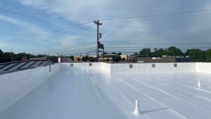 A flat TPO roofing system on a commercial building.